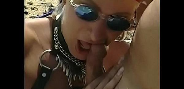  Lusty slut Nena Cherry in leather gear rides a young stud dick in desert